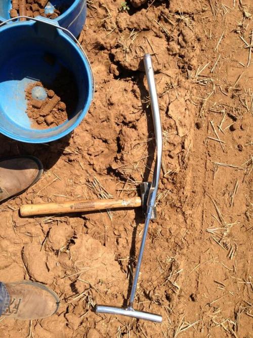 Soil testing is not always easy, but it is time well spent. My high school shop teacher would have labeled me a "Primitive Pete" for this photo. 